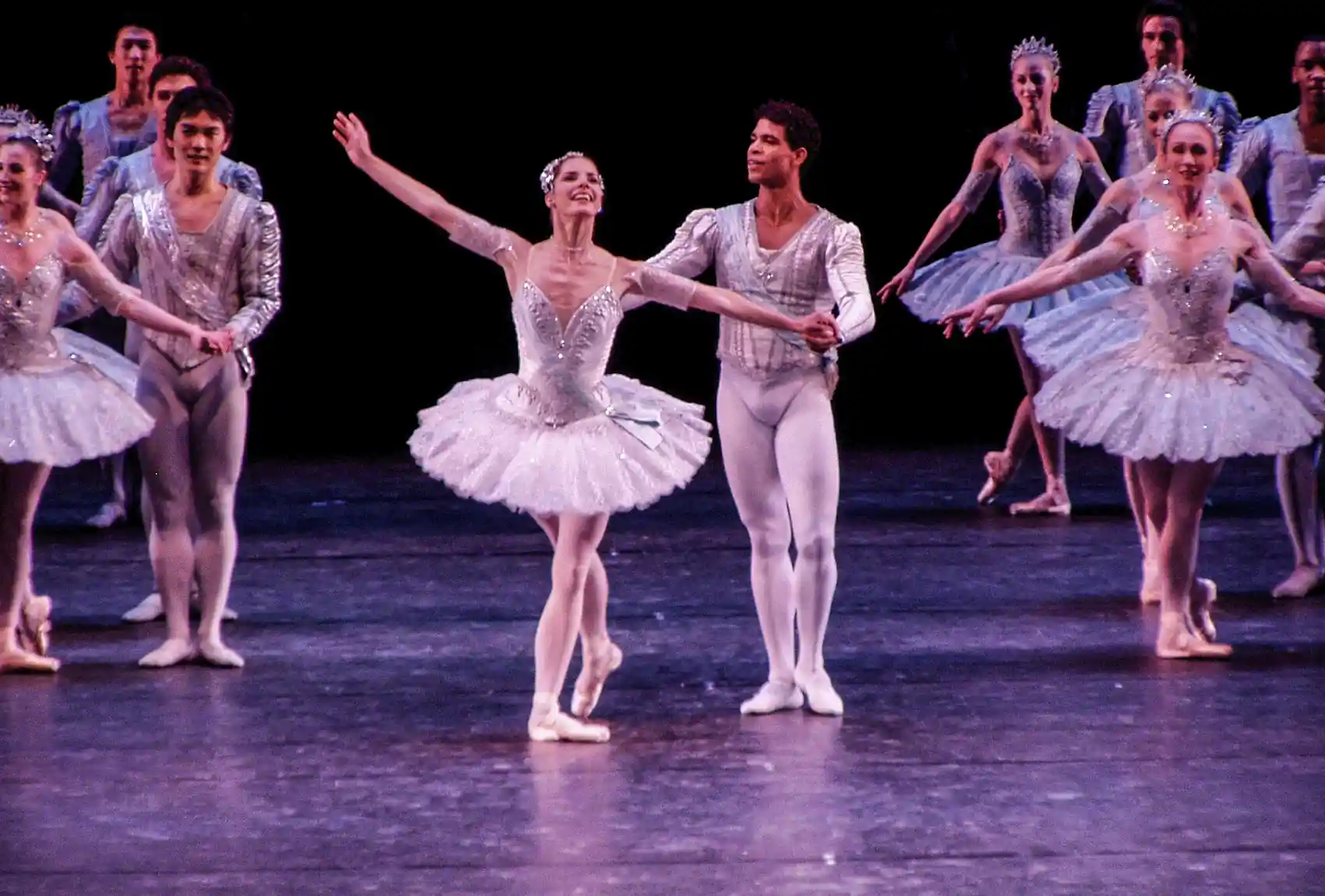 Take in the grace of a Christmas ballet performance, when talented dancers in exquisite costumes captivate the audience with their performance at one of the famous theatres in London, England. Ballet dancers on stage doing a Christmas production in London.