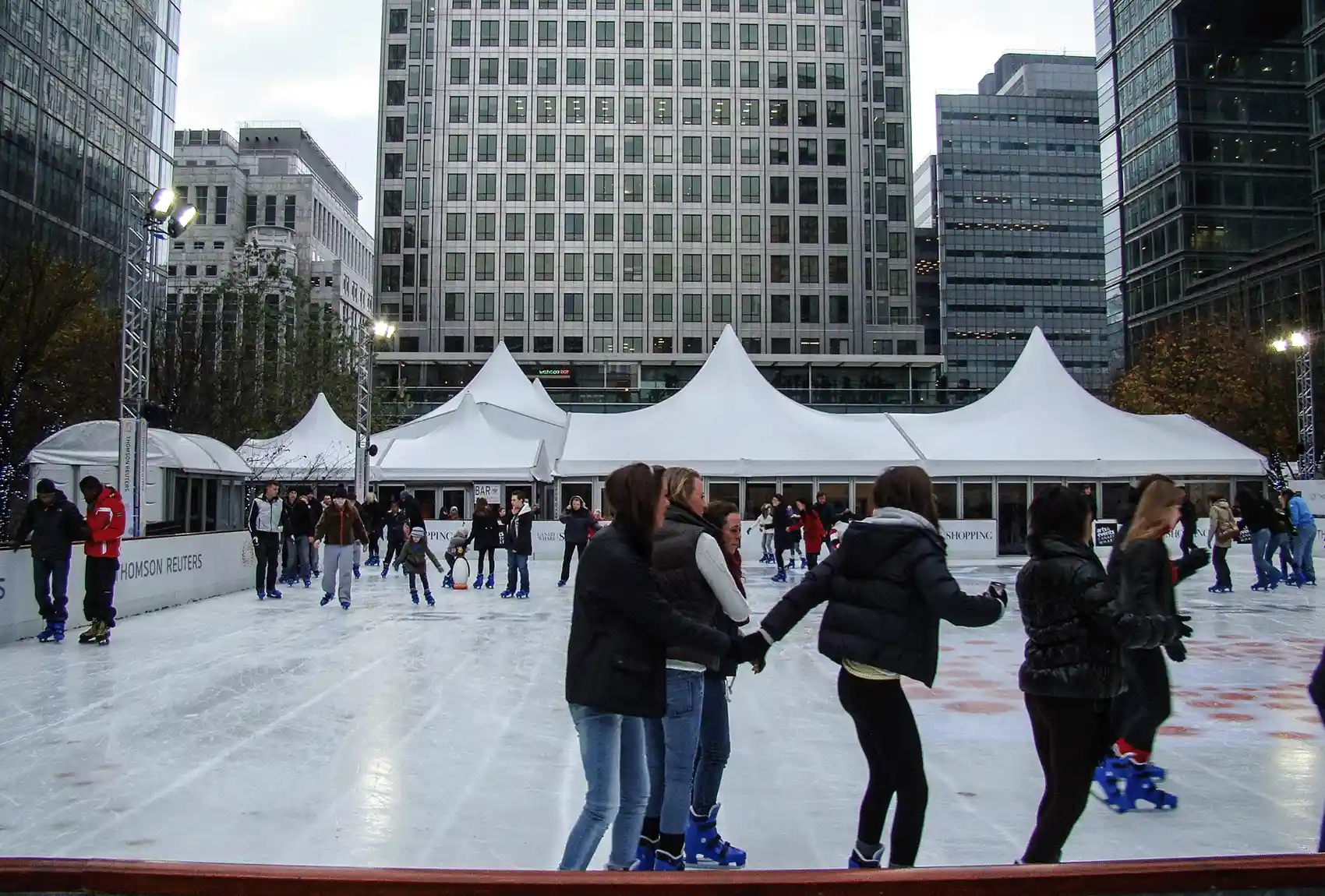 Enjoy a fun-filled day of ice skating at the outdoor rink in Canary Wharf, which is flanked by the tall office skyscrapers of London's financial centre. Ice skating in London's Canary Wharf: A festive way to enjoy the city.