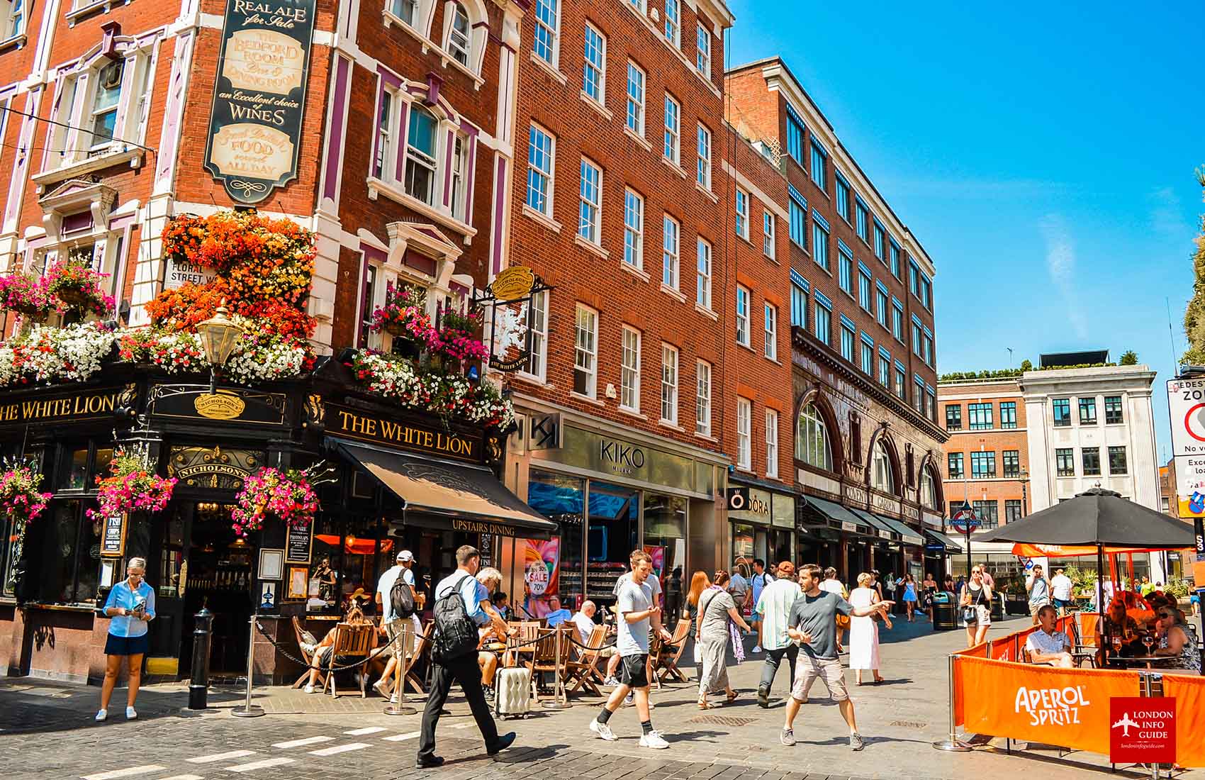 The White Lion Pub with colorful flowers and outdoor seating at Covent Garden, London.