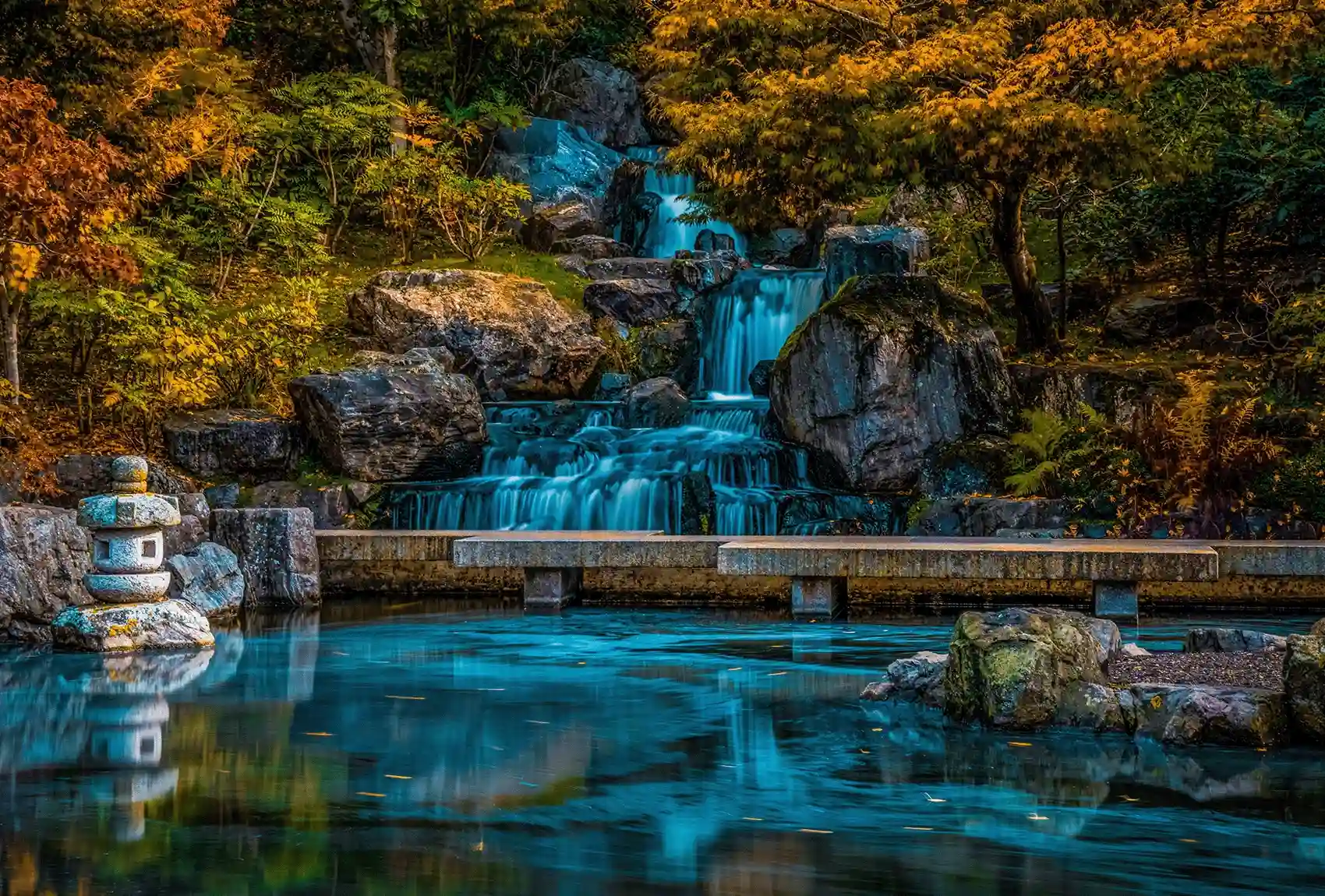 A peaceful view of a hidden Japanese oasis, the Kyoto Garden waterfall in Holland Park Kyoto Garden waterfall in Holland Park, London