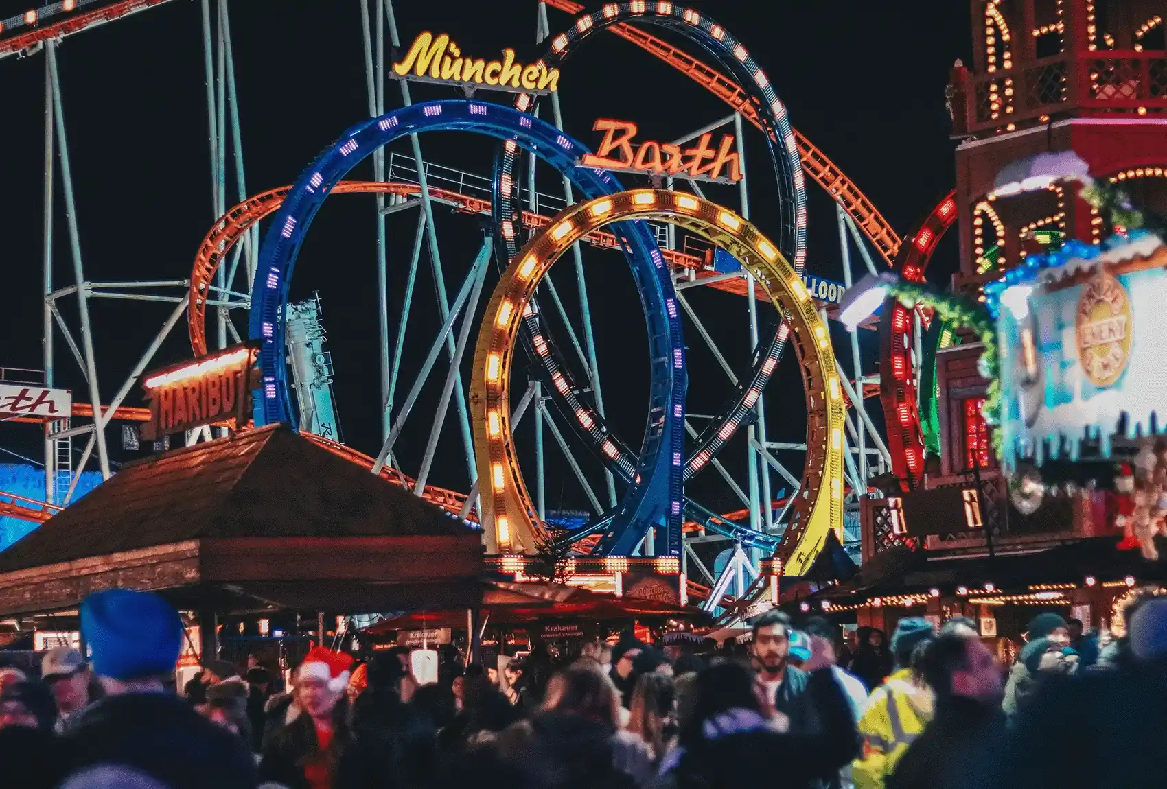 At Hyde Park, London, Winter Wonderland comes alive with colourful rollercoaster loops and market stalls. Winter Wonderland at Hyde Park, London, with colourful rollercoaster loops.