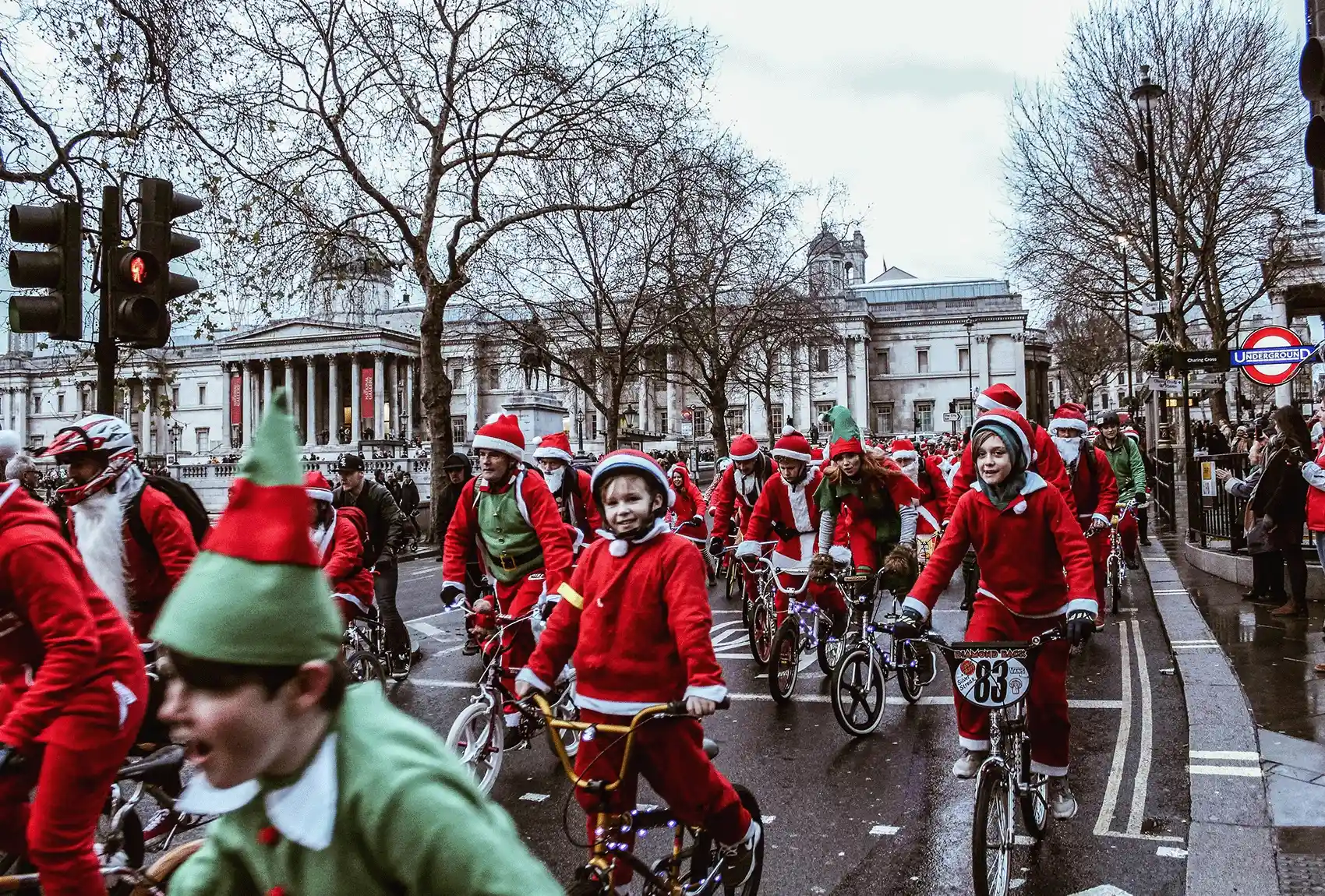 Santa and elves cyclists at a Christmas parade in Trafalgar Square. London Christmas parade cyclists at Trafalgar Square.