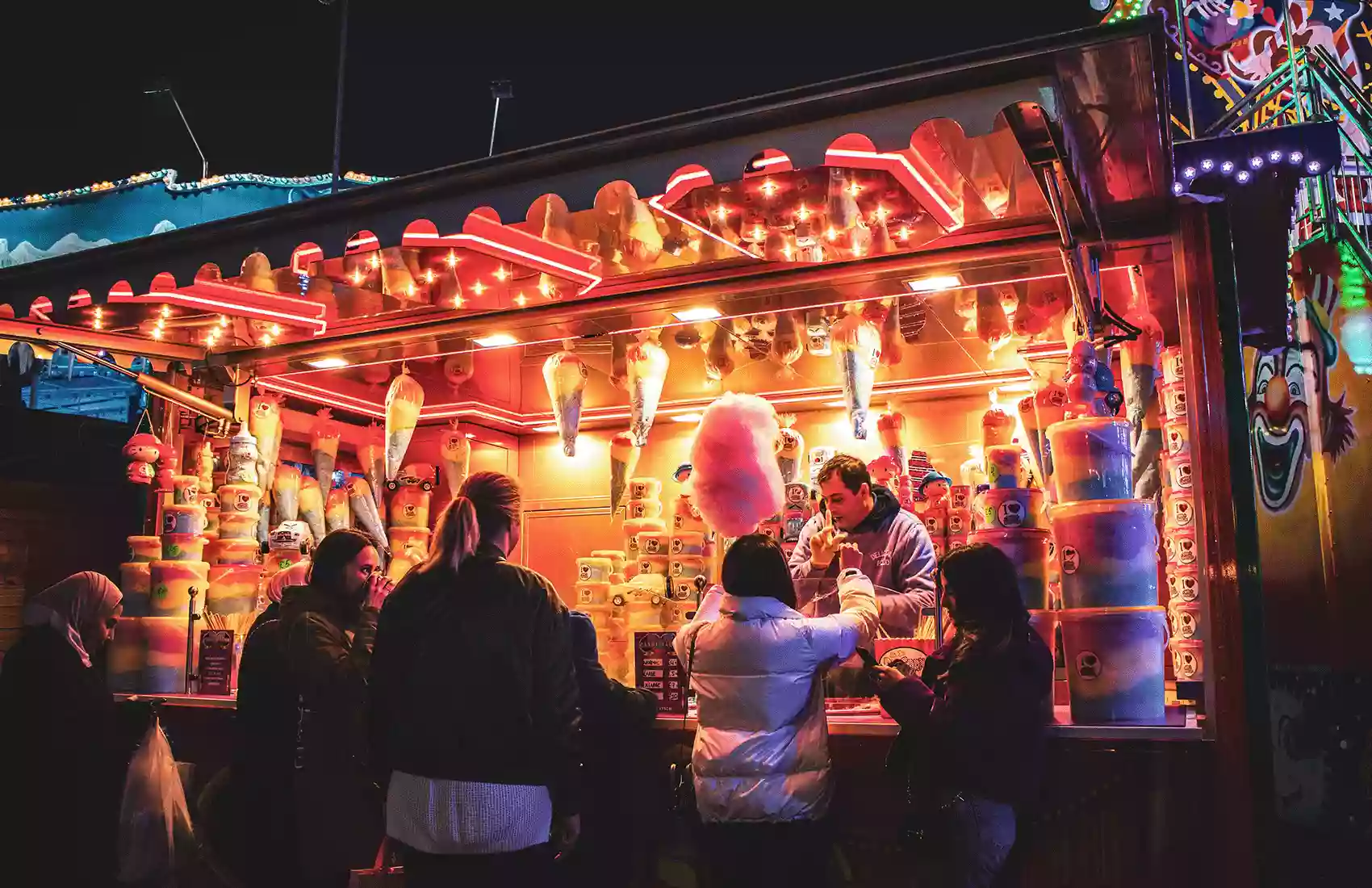 People buying candyfloss at a Christmas market London. London Christmas Market Hyde Park - Winter Wonderland Christmas market London.