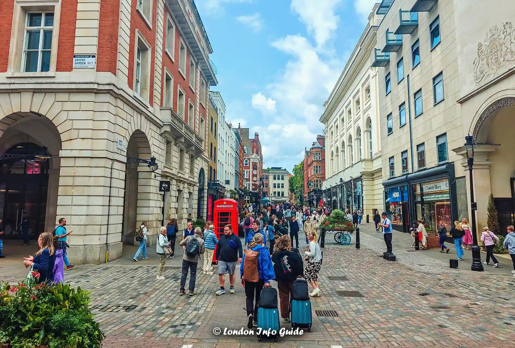 People walking in London near Covent Garden and shops.