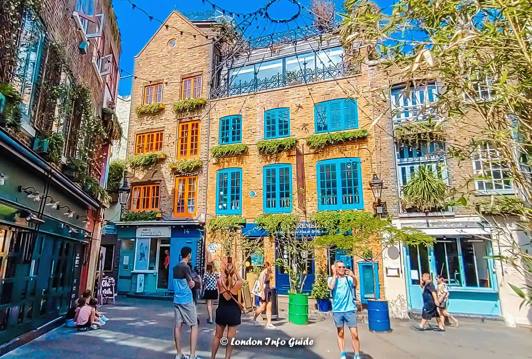 A popular spot at Covent Garden London where people stop by to take stunning photos of the buildings facades. Neals Yard Covent Garden, a beautiful corner in London.