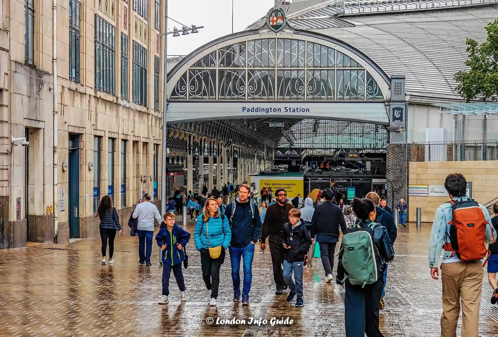 Paddington Station London entrance with people walking.