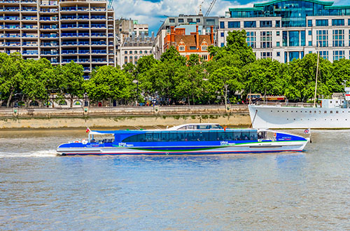River cruise boat on the river Thames London.