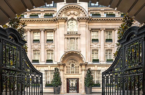 Rosewood London Courtyard Hotel with grand London building and ornate gated entrance. Rosewood London Courtyard.