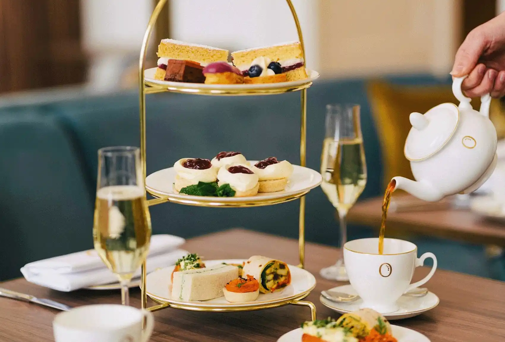 A classic afternoon tea served at The Orangery with cakes, sandwiches, and scones