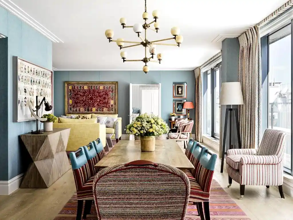 The Ham Yard Hotel London with stylish dining area and colorful chairs.