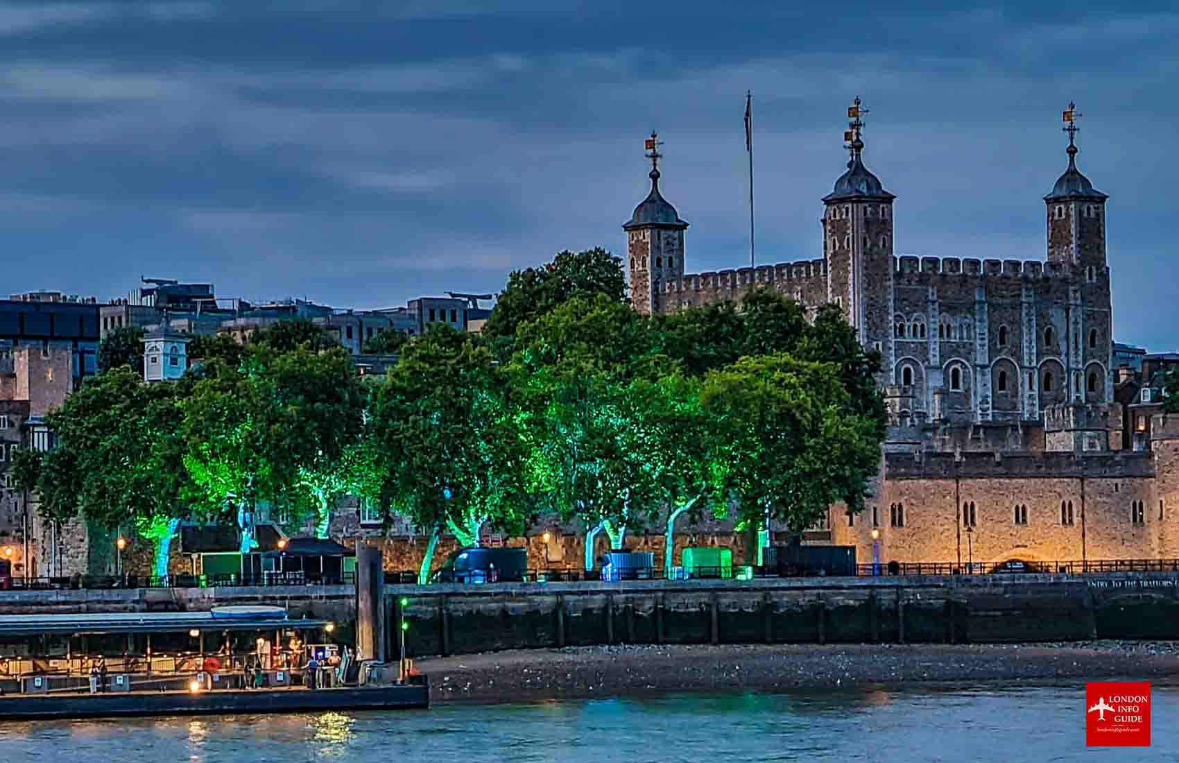 A night view of the Tower from the other side of the River Thames. Tower of London at night.