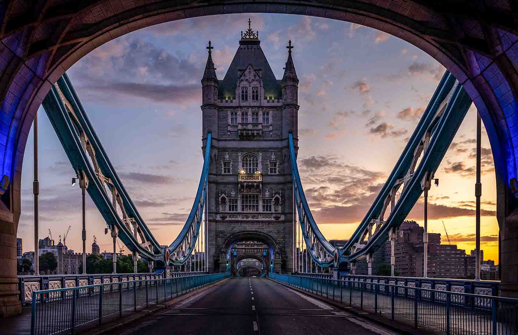 The Road Crossing The Tower Bridge at sunset.