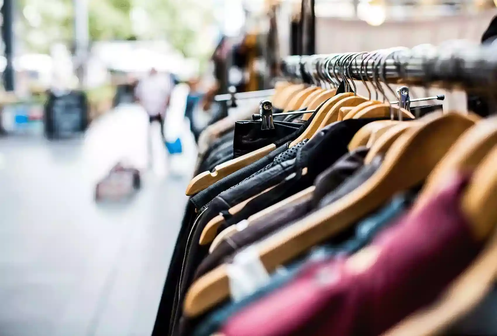 Clothes hung on hangers at a market in London.