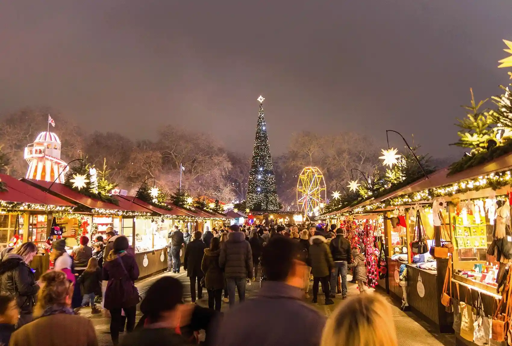 The Winter Wonderland at Hyde Park, London, with Christmas markets, is enjoyed by numerous people. Hyde Park Winter Wonderland with Christmas markets.